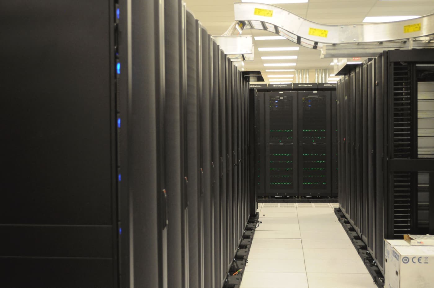 Rows of black server racks in a data centre